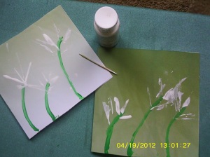 white paint with tooth pick dipped in it and pressed`on diagonal at top of green stems 